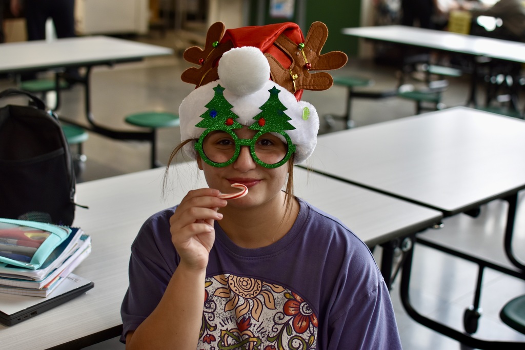 8th grader wearing holiday hat and glasses 