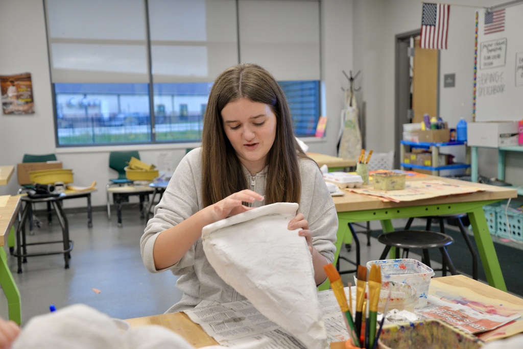 working hard on paper mache